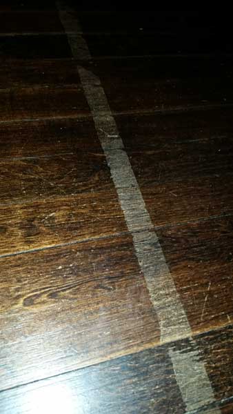 Don't use tape on wood floors