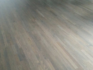 Custom grey stain with a red oak wood floor on a 45 degree angle