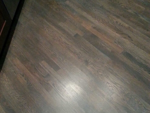 Custom grey stain with a red oak wood floor on a 45 degree angle